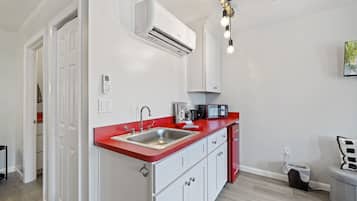 Microwave, coffee/tea maker, dining tables