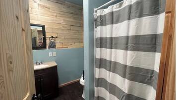 Shower, hair dryer, towels, shampoo