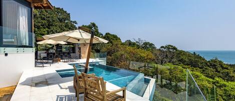 Outdoor pool, pool umbrellas, pool loungers