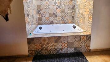 Shower, jetted bath, towels, soap