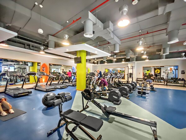 A gym with treadmills, weight machines, and free weights. - Silkhaus Bahar (Dubai)