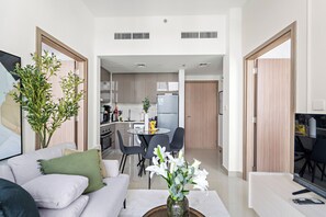 Family Apartment | Living area | 50-inch Smart TV with digital channels - Silkhaus Azizi Aura (Dubai)