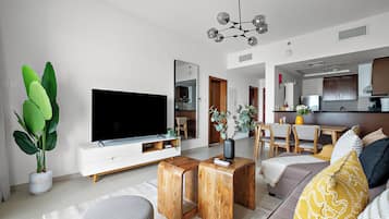 City Apartment | Living area | 50-inch Smart TV with digital channels