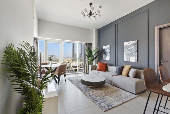 Elite Apartment | Living area | 50-inch Smart TV with digital channels - Silkhaus Marina Rise Towers (Abu Dhabi)