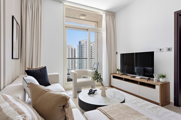 Senior Apartment | Living area | 50-inch Smart TV with digital channels - Silkhaus Mangrove Place (Abu Dhabi)