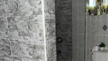 Shower, towels, soap, toilet paper