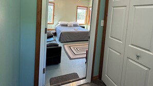 A bedroom with a bed, a ceiling fan, and a window. - Cozy B&B in walking distance to onsite tasting room in Lee! (Lee)
