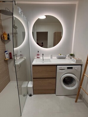 Shower, hair dryer, towels, soap