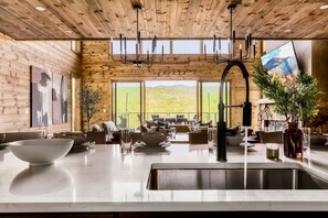 Enjoy meals in the spacious kitchen and dining area with a mountain view.