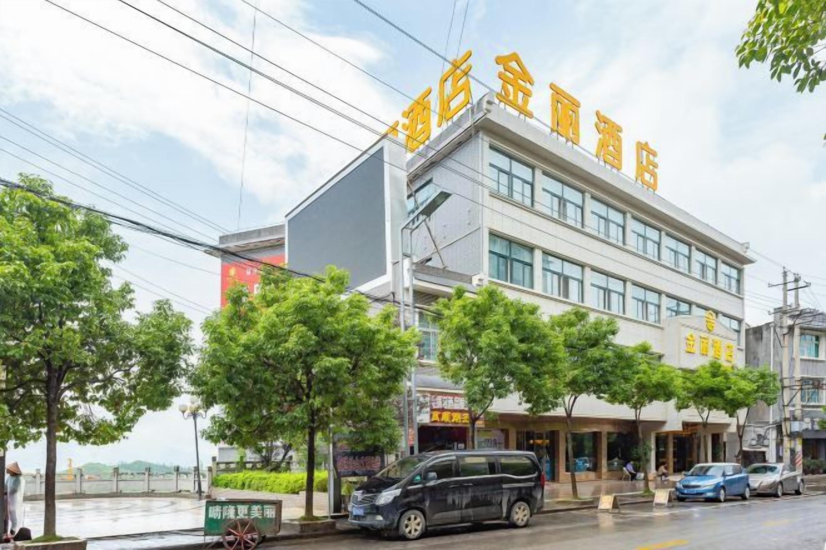A hotel with a modern facade, multiple floors, and a sign indicating it is a hotel.