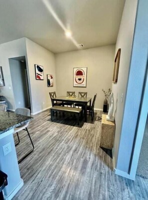 Enjoy meals in this cozy dining area with a dining table, six chairs, and a bench.