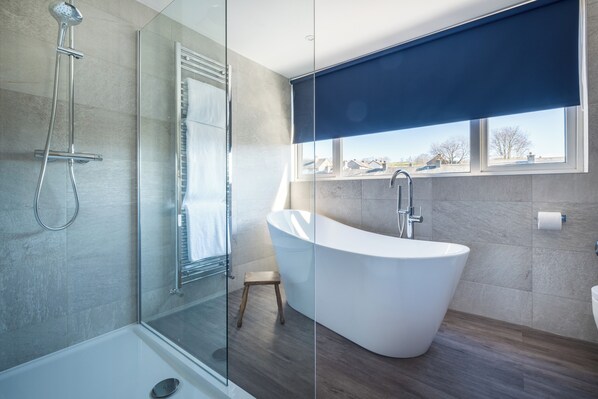 Shower, hair dryer, towels, toilet paper