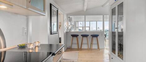 Fridge, stovetop, dishwasher, coffee/tea maker