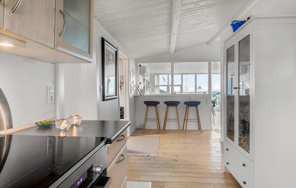 Fridge, stovetop, dishwasher, coffee/tea maker