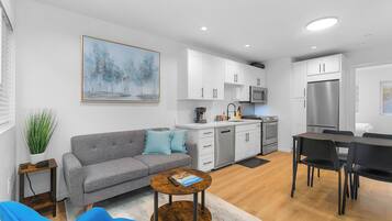 Comfort Apartment | Living area | 40-inch flat-screen TV with digital channels