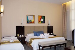 A hotel room with two beds, a TV, artwork on the wall, and a window with curtains. - Yong Feng Hongli Hotel (Tianjin)