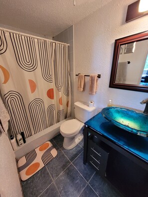 Shower, eco-friendly toiletries, hair dryer, towels