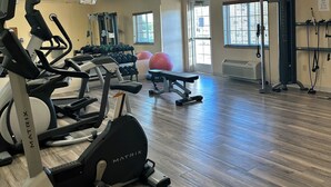 A gym with treadmills, weight machines, and exercise balls. - Western Slope suites (Parachute)