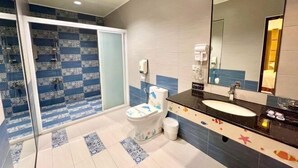 A bathroom with a toilet, sink, and mirror. - Wei Fengqing Motel (Tainan) (Tainan)