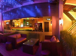 An outdoor bar area with seating and a counter. - LA Hotel Tawau (Tawau)