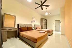 A hotel room with two beds, a desk, a ceiling fan, and a large mirror. - Puchong Setiawalk Penthouse for 14 Pax Iconique (Puchong)