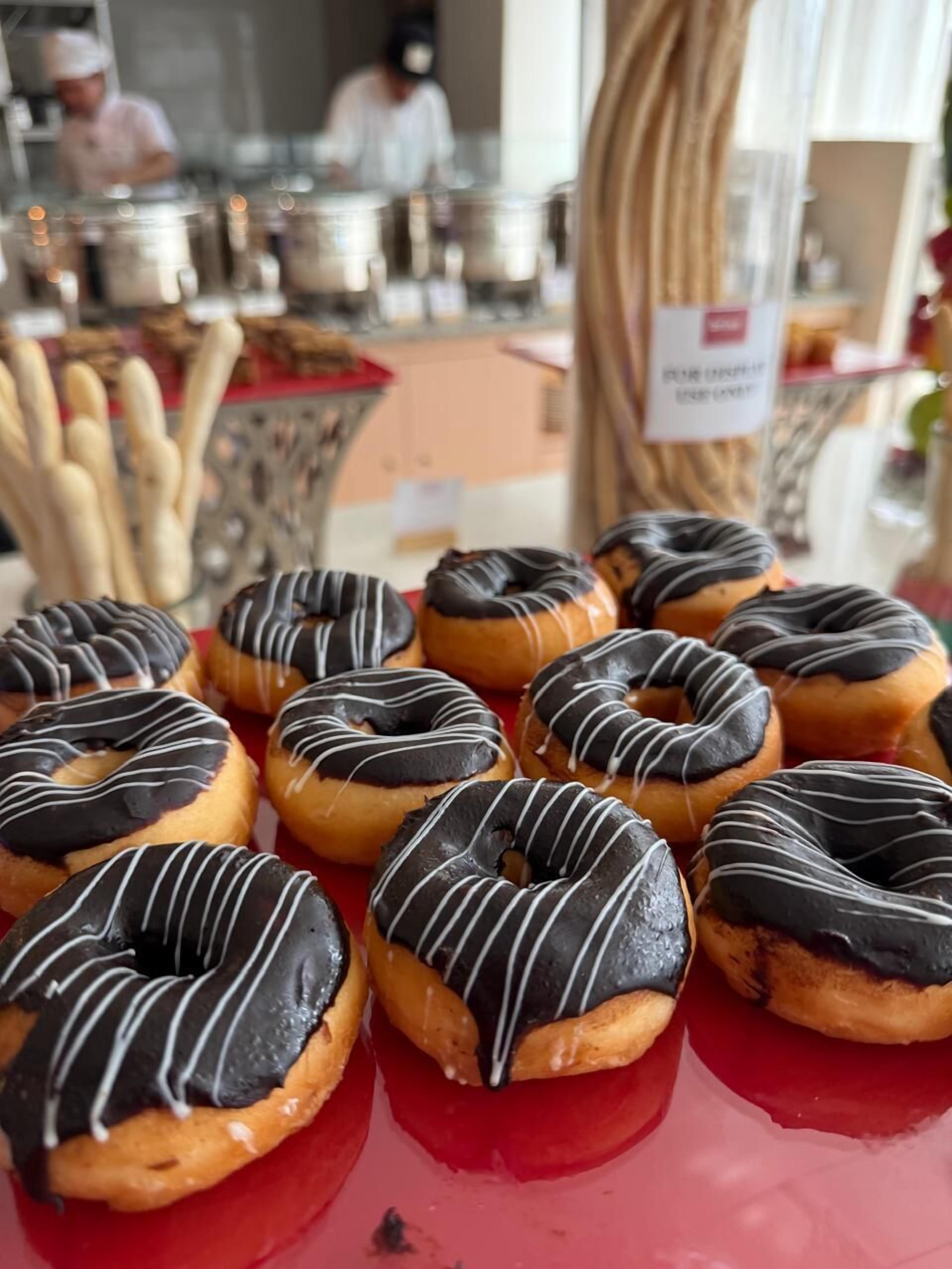 A display of glazed donuts on a table.