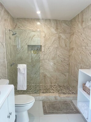 Shower, hair dryer, towels, soap