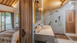A bathroom with a wooden ceiling, a large mirror, a shower, and a sink. - Villa Diamond  (Lembongan Island)