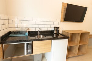 Mini-fridge, microwave, cookware/dishes/utensils