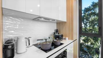 Coffee/tea maker, fridge, microwave, oven