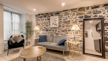 Deluxe Apartment, Patio | Living area | 55-inch flat-screen TV with cable channels, TV