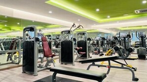 A gym with various exercise machines, benches, and mirrors. - KULAI IOI Mall D'Putra Near JPO Senai Airport (Kulai)