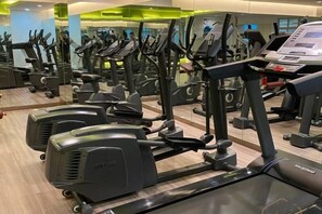 A gym with multiple exercise machines, including treadmills and elliptical trainers. - KULAI IOI Mall D'Putra Near JPO Senai Airport (Kulai)
