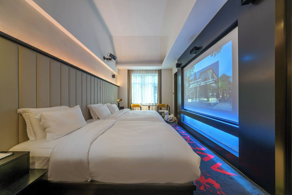FamilieTwin kamer | Luxe beddengoed, donsdekens, Select Comfort-bedden, een gratis minibar