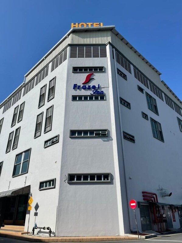 A hotel building with a sign reading 'HOTEL' and 'Frazel Inn' on the facade. - Frazel Inn (Parit Buntar)