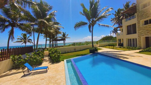 Nothing but Blue Skies and Endless Beach from this Comfortable Beachfront Condo