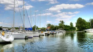 A marina with several sailboats docked.
