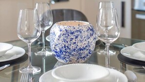 A dining table set with plates, glasses, and a decorative bowl. - Ealing 3 Bath Flat w/ Parking | 10 mins to Station (London)