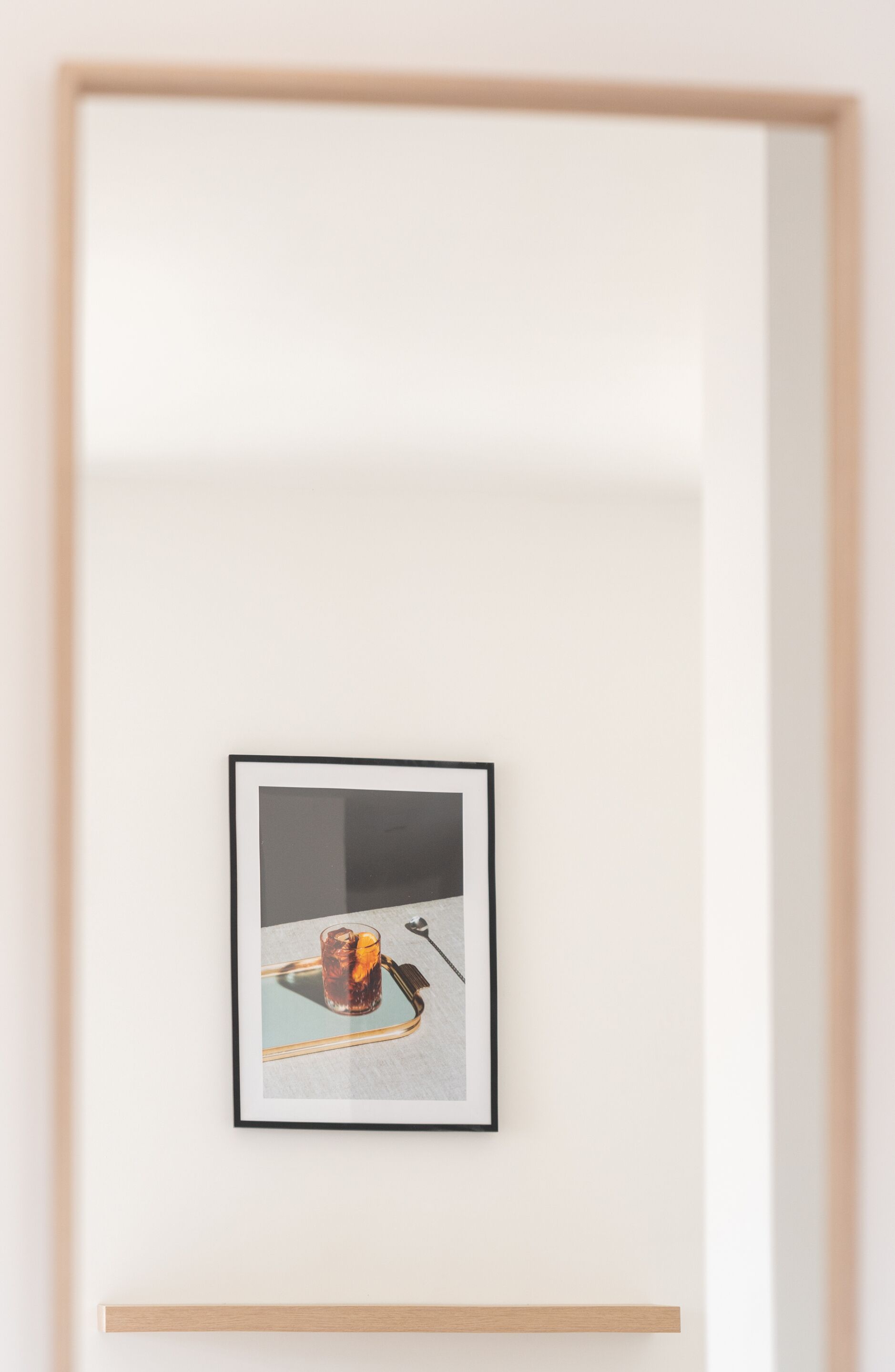 A framed artwork on a wall.