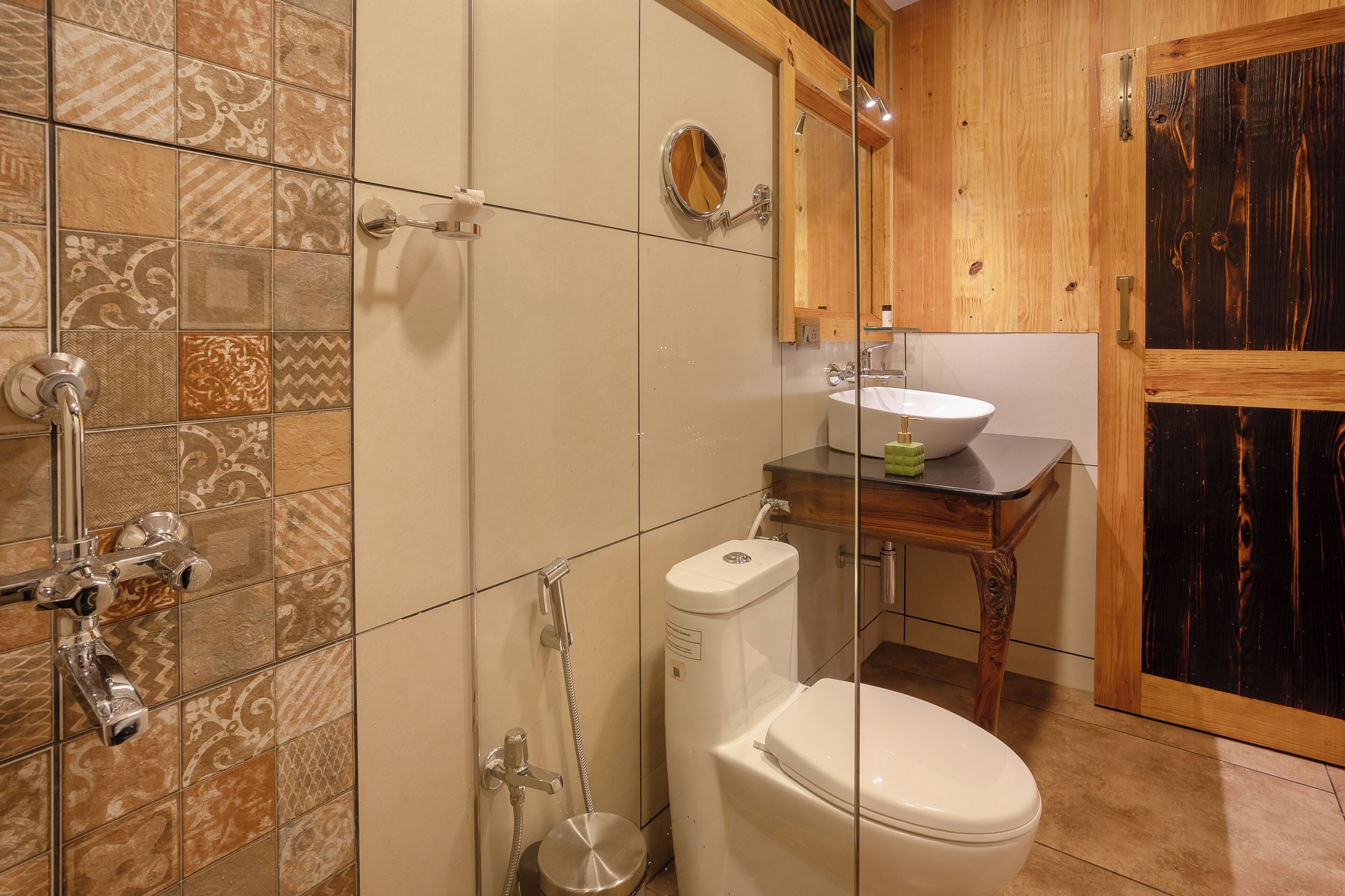A bathroom with a toilet, sink, and shower.