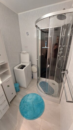 Shower, hair dryer, towels, soap