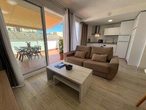 Deluxe Penthouse, 2 Bedrooms, City View | Living area | 45-cm Smart TV with satellite channels - apartamentos Rincón del mar  (Velez-Malaga)
