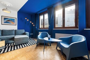 Deluxe Apartment, City View | Living area | Flat-screen TV - 4ty3-Apartments Naschmarkt City Apt (Vienna)
