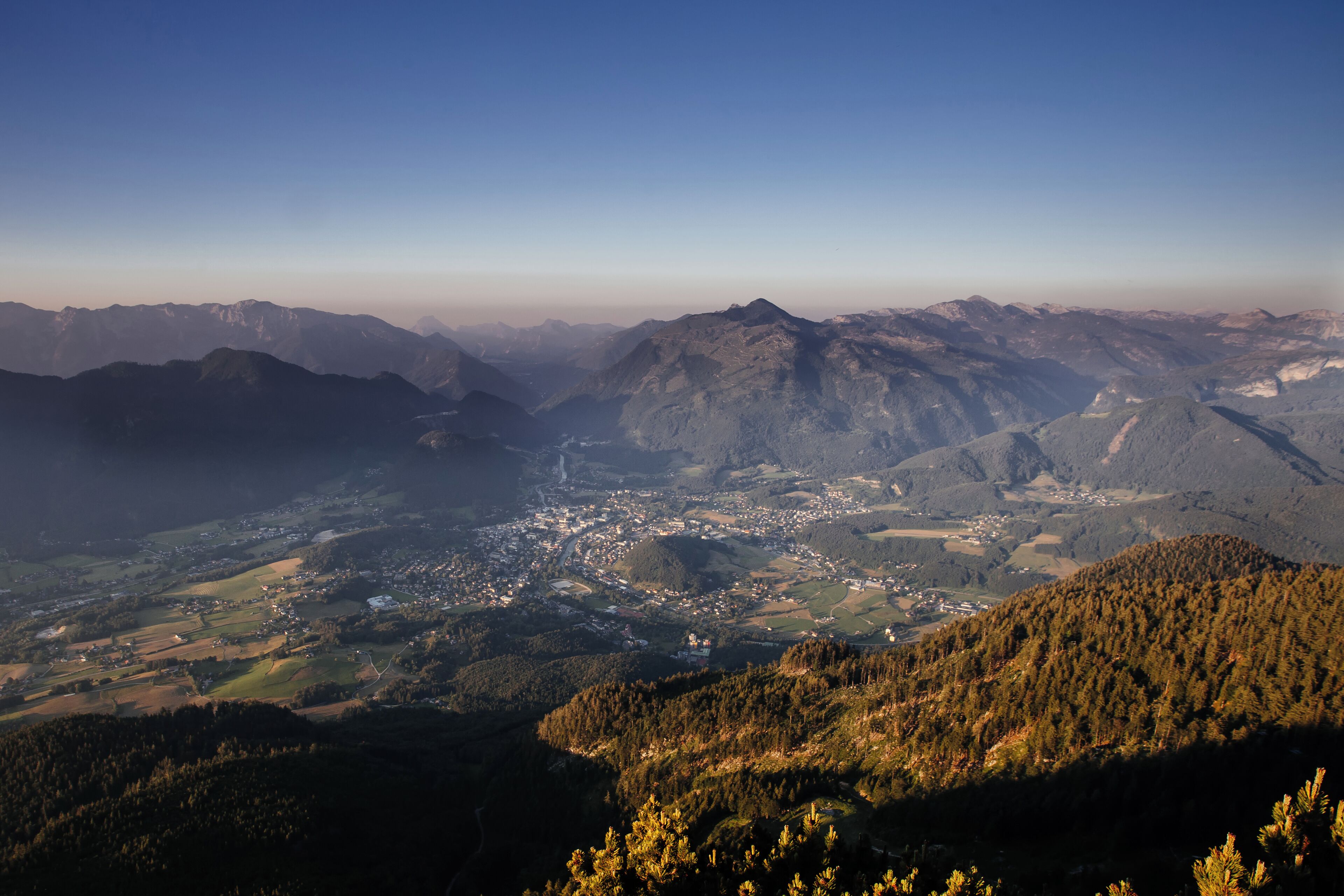 A mountainous landscape with a town nestled in the valley.