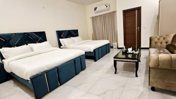 Deluxe Triple Room, City View | In-room safe, iron/ironing board, free WiFi, bed sheets