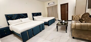 Deluxe Triple Room, City View | In-room safe, iron/ironing board, free WiFi, bed sheets