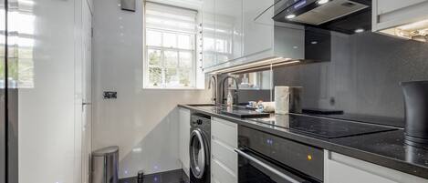 Fridge, oven, electric kettle, cookware/dishes/utensils