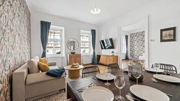 Deluxe Apartment, City View | Living area | Flat-screen TV