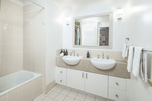 Hair dryer, towels, shampoo, toilet paper