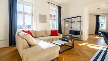 Deluxe Apartment, City View | Living area | Flat-screen TV